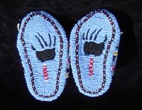 <h2>Memorial Moccasins 3
</h2><p>Memorial Moccasins made by Betty Edwards and Tony Robles, that he presented at Mantle Rock, on behalf of the both of them.<br></p>