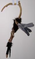 <h2>War Stick
</h2><p>War club made with a deer antler, decorated fur, suede, and heron feathers.
</p>